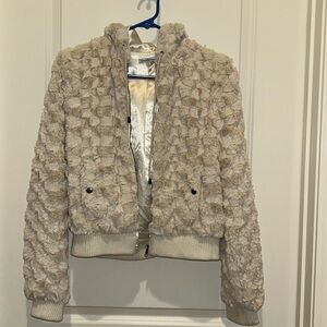A cute soft jacket. Silky on the inside.